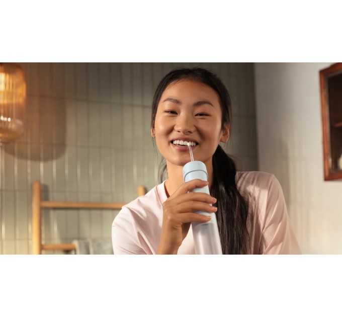 Ирригатор Philips Sonicare Compact Flosser 1000, чаша 200 мл, складной, голубой