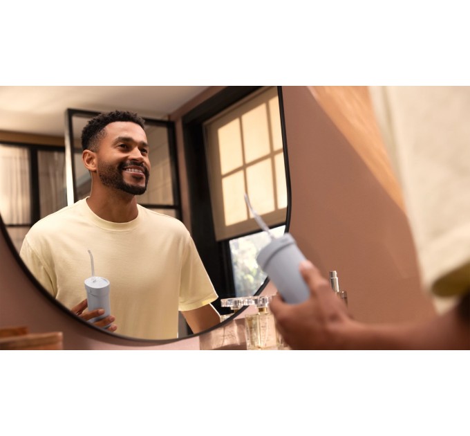 Ирригатор Philips Sonicare Compact Flosser 1000, чаша 200 мл, складной, голубой