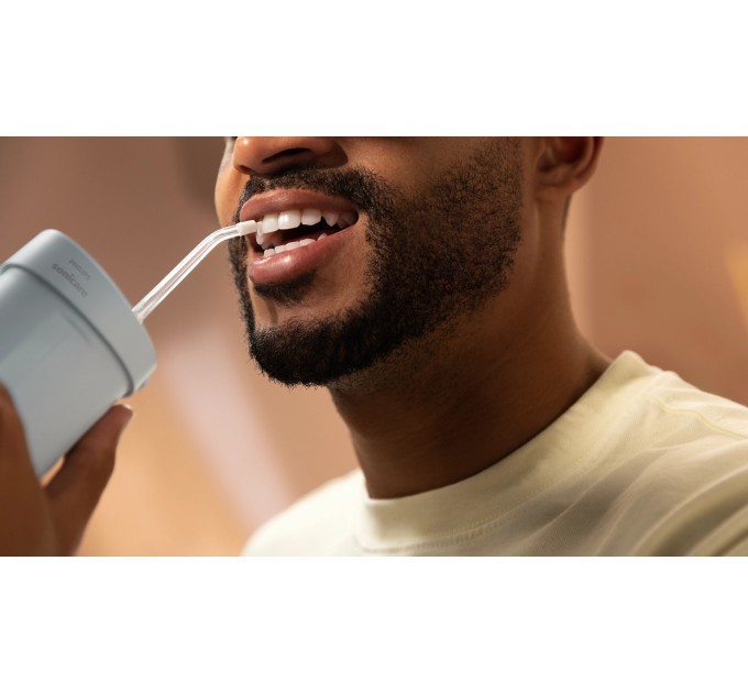 Ирригатор Philips Sonicare Compact Flosser 1000, чаша 200 мл, складной, голубой